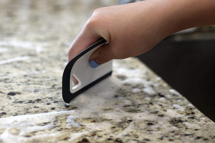 Handy curved squeegee with four types of blade design